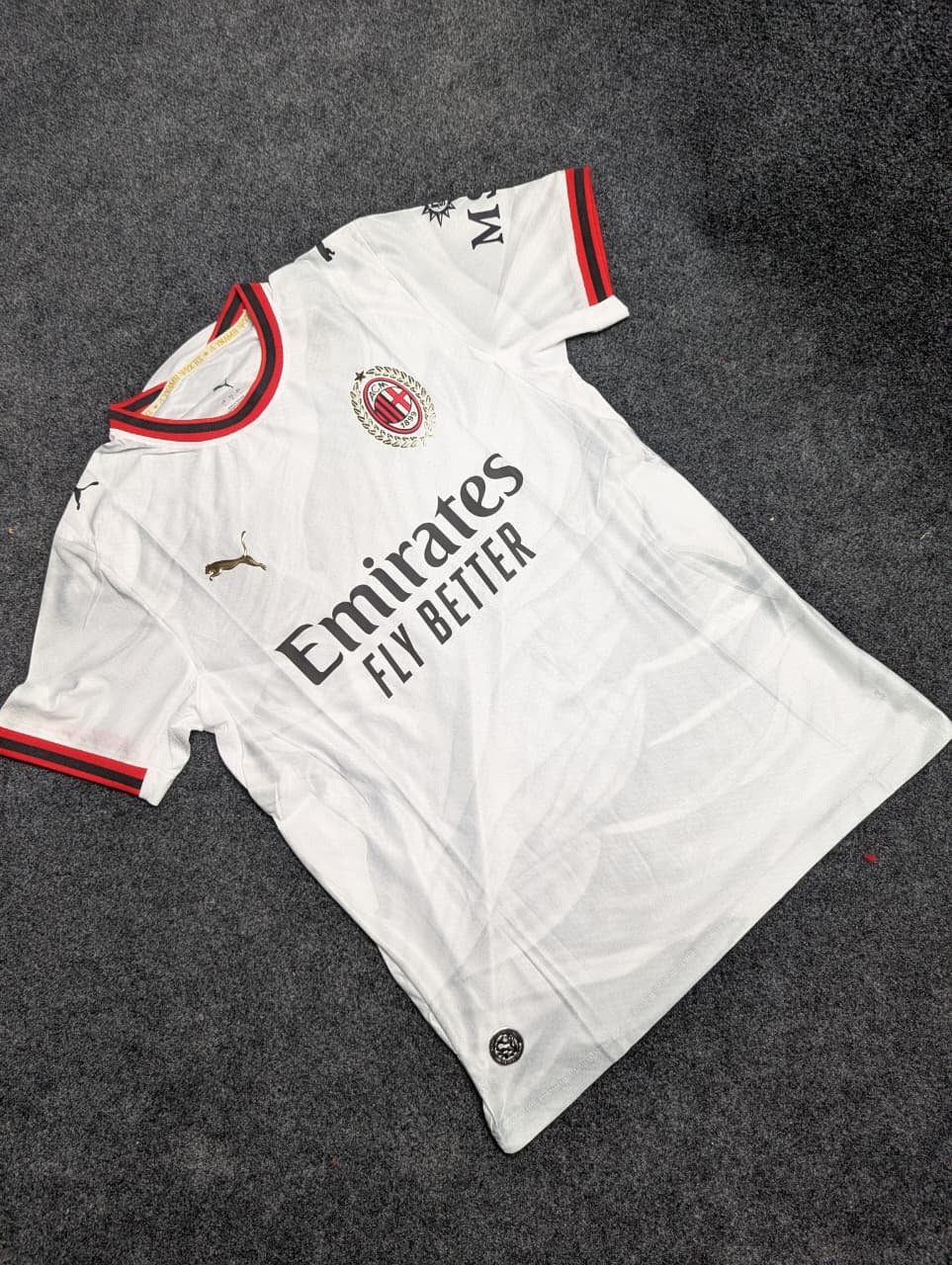 AC Milan Away 2026-27 football jersey — white with gold laurel detailing, view 18