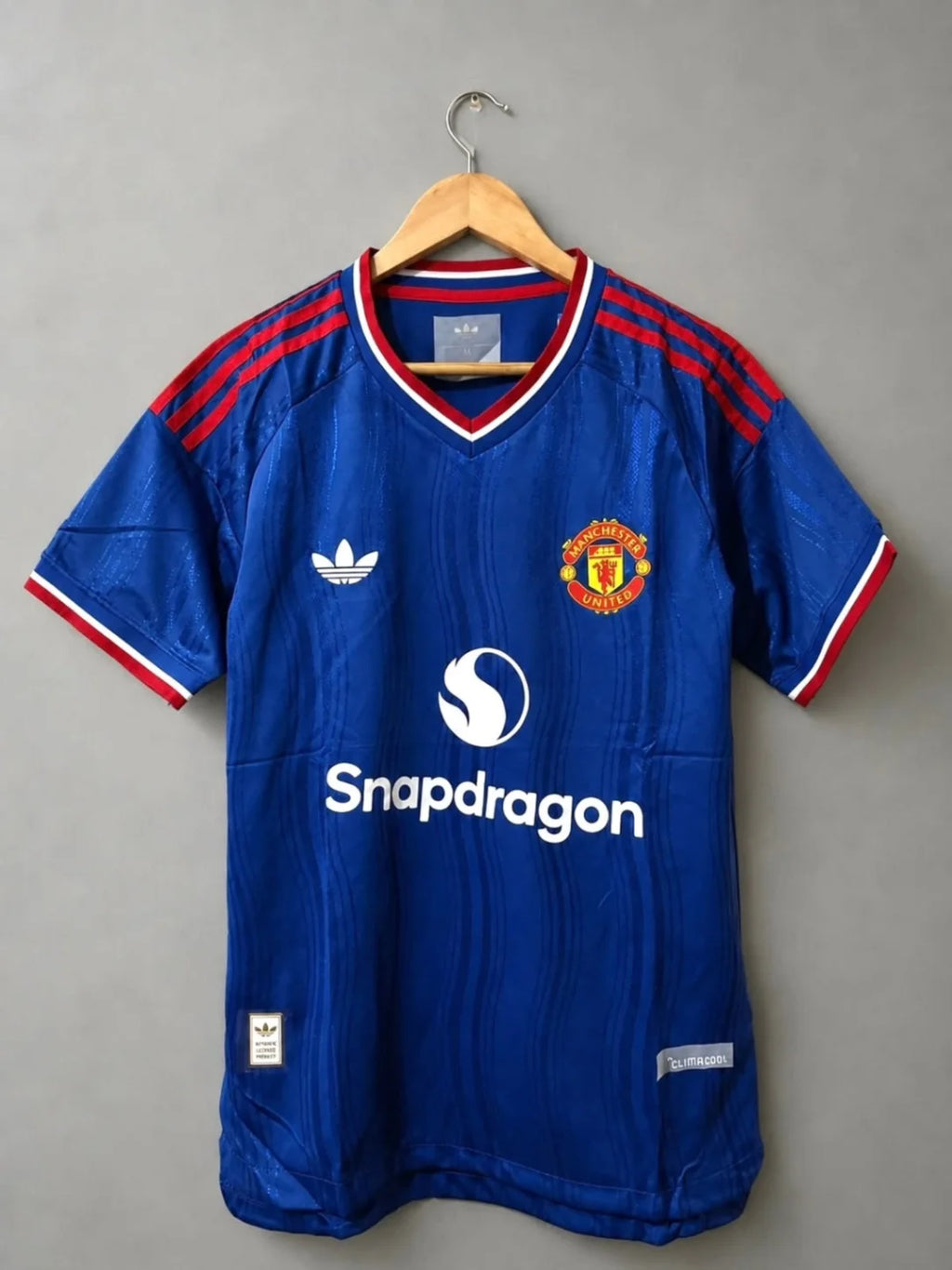 Manchester United Away 2026-27 football jersey — royal blue with red and white trim, view 8